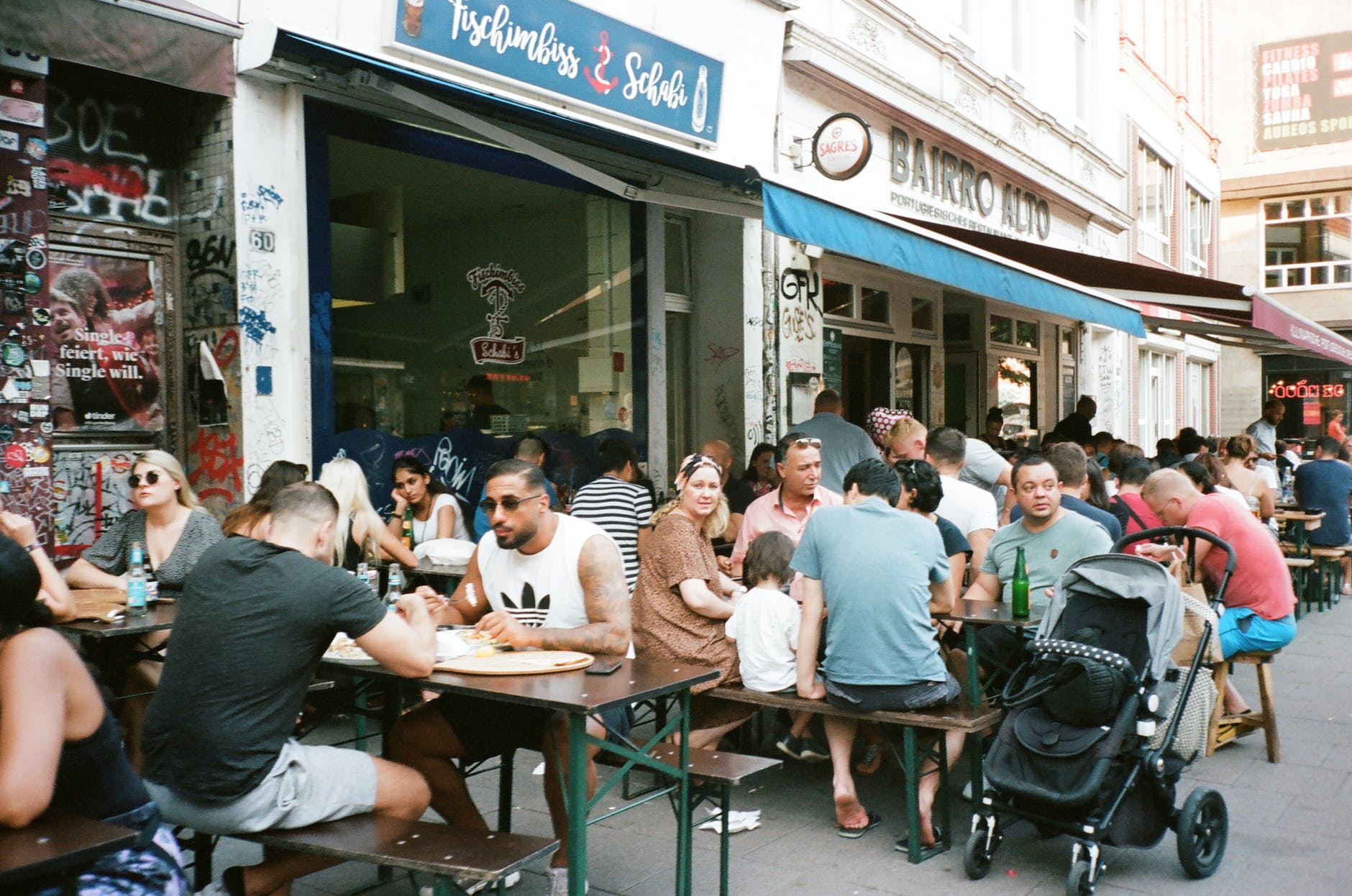 people eating beside building